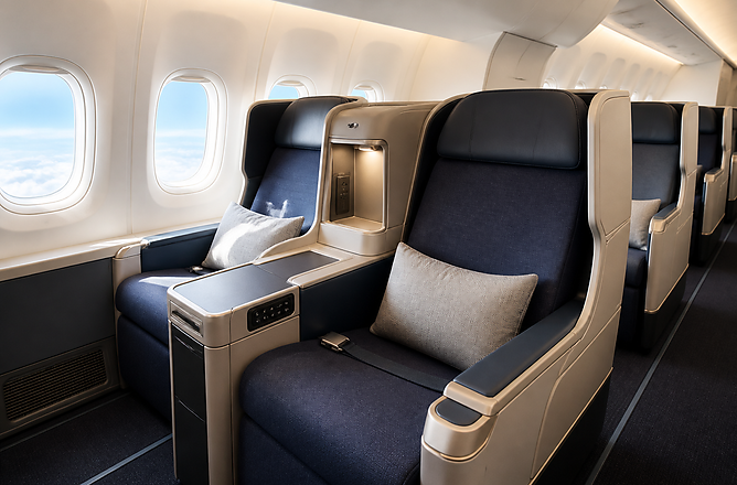 Modern long-haul business class cabin with spacious lie-flat seats